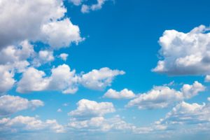 blue sky with white fluffy clouds