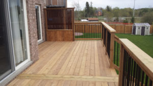 deck with privacy fence and railing